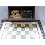 A MARBLE AND MALACHITE CHESS SET in a wooden box and a folding chess board