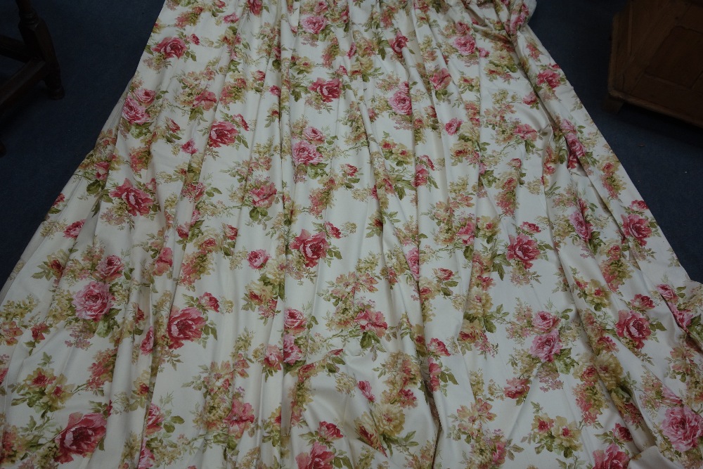 A PAIR OF FLORAL COTTON CURTAINS, approx 235cm drop, pleated headings approx 130cm wide, as new with