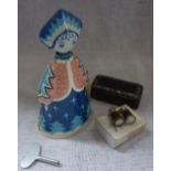 A VINTAGE TINPLATE CLOCKWORK TOY of a woman on wheels, a 19th century snuff box and a pair of