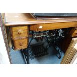 A VINTAGE SINGER TREADLE SEWING MACHINE