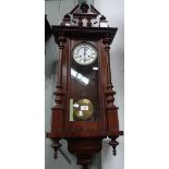 A WALNUT CASED VIENNA STYLE WALL CLOCK