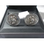 DUNHILL: Gentleman's silver cufflinks, with St Christopher decoration, curved solid bar connections,