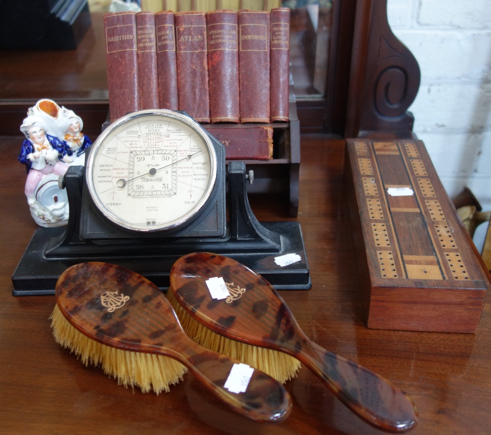 A 1930'S BAKELITE CASED DESK BAROMETER, a crib board, two faux tortoiseshell brushes, a small
