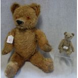 A VINTAGE PLUSH TEDDY BEAR with jointed limbs, 50cm high and a small bear, 13cm high (2)