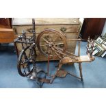 AN ANTIQUE FRUITWOOD SPINNING WHEEL, 90cm wide and a similar upright spinning wheel (2)