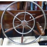 A VINTAGE STEEL AND HARDWOOD BOAT WHEEL