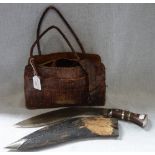 A CROCODILE HANDBAG, A KUKRI, AND A BOY SCOUTS BELT; BE PREPARED