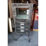 A VINTAGE STYLE MEDICAL INSTRUMENT CABINET in steel with glass panels, 36cm wide