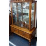 A VINTAGE GLAZED FINNISH CABINET, with two lower drawers on cabriole legs, 140cm high x 96cm wide