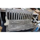 A WEATHERED TEAK GARDEN BENCH, 132cm wide