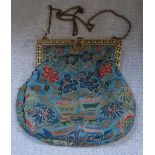 AN EDWARDIAN GILT FRAMED EVENING BAG, MADE FROM FRAGMENTS OF CHINESE EMBROIDERED SILK