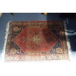 A BLUE GROUND IRANIAN RUG, 108cm x 154cm (plus fringes)