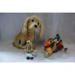 A VINTAGE WEST GERMAN TINPLATE TOY CLOWN, A SIMILAR MOTORCYCLE AND SIDECAR, and a plush toy dog