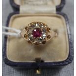 A 'RUBY' AND DIAMOND DRESS RING, on an 18ct yellow gold shank, ring size J