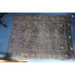 A PERSIAN RUG WITH GEOMETRIC BORDERS (worn) 122cm x 168cm