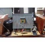 A RESTORED DOLLS HOUSE, fully furnished 'Lighthouse Cottage' with boat house and lighthouse