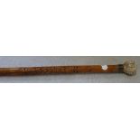 A JAPANESE BAMBOO AND IVORY WALKING STICK, the shaft and handle carved with many faces