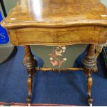 A VICTORIAN FIGURED WALNUT WORK TABLE, with fold open chess board and backgammon board, 60cm wide