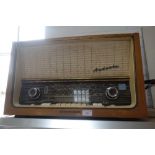 A VINTAGE TELEFUNKEN 'ANDANTE' RADIO in a walnut case, circa late 1950s/early 1960s