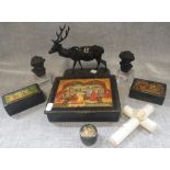 A CAST METAL MODEL OF A STAG, A 19TH CENTURY IVORY CROSS, RUSSIAN BOXES, AND TWO BUSTS OF PUTTI