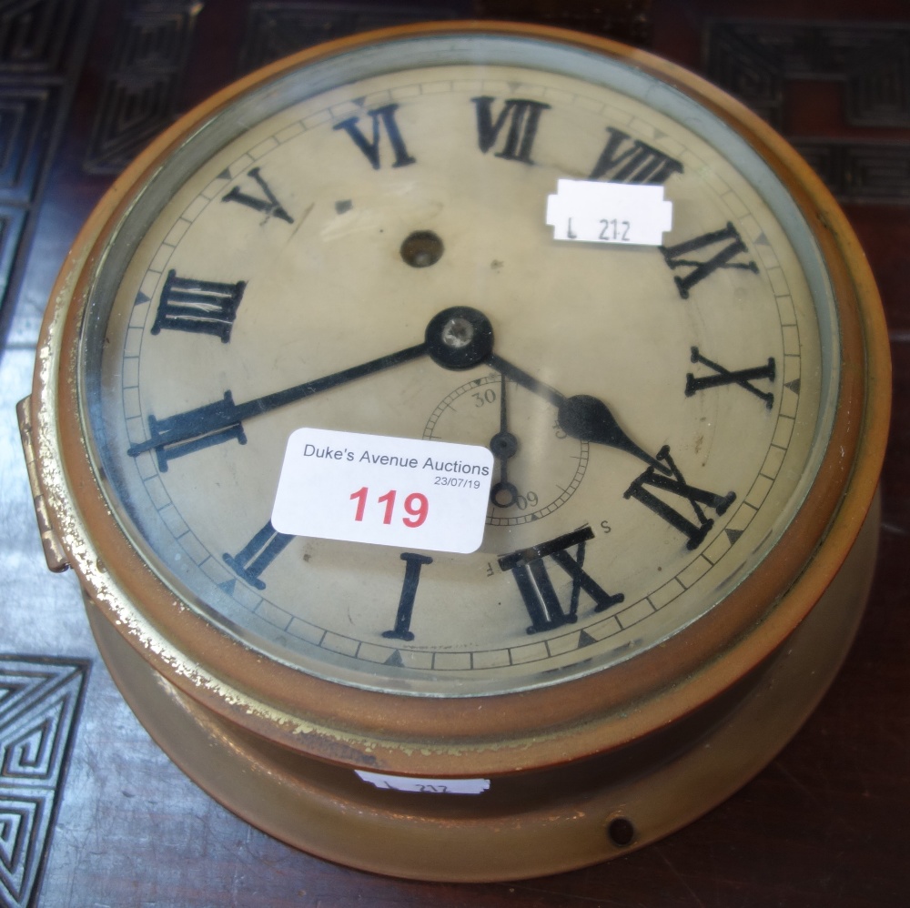 A BRASS CASED SHIP'S CLOCK, 19cm dia.