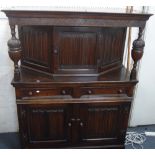 A REPRODUCTION OAK COURT CUPBOARD with linenfold panels, 125cm wide