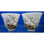 A PAIR OF 19TH CENTURY CHINESE KANGXI CUPS with six character mark to the bases, 5cm high