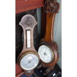 AN OAK ANEROID BAROMETER and another similar (2)