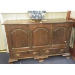 AN 18TH CENTURY MULE CHEST with shaped fielded panels (converted to a cupboard), 148cm wide