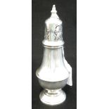 A SILVER CASTOR, baluster form, pull-off pierced cover with knop finial, on a circular foot, 15.