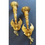 A PAIR OF GILT WALL LIGHTS OF CLASSICAL FORM, each with a phoenix and brass 'flames', 60cm high