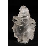 A CHINESE CARVED ROCK CRYSTAL VASE AND COVER, of flattened baluster form, the sides carved with