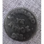A 19TH CENTURY LEAD TOKEN OR SPURIOUS ANTIQUITY BEARING A CRUDE ROYAL PORTRAIT AND THE LEGEND '