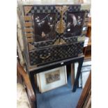 A JAPANESE BLACK LACQUERED CABINET ON STAND, the doors decorated with birds and insects inlaid