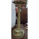 JUDAICA: A circular brass column Menorah lamp with inscription, 44cm high