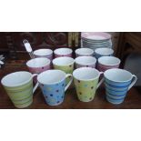 A COLLECTION OF BRIGHTLY DECORATED COFFEE CUPS and saucers