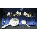 A COLLECTION OF THREAD AND SHELL PATTERN FLATWARE, a miniature silver-backed hand mirror and an