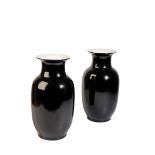 A PAIR OF CHINESE BLACK-GLAZE BALUSTER VASES, LATE QING / REPUBLIC PERIOD, the sides covered in a