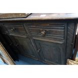 A MAHOGANY BOWFRONT SIDEBOARD, a dark oak sideboard and an Edwardian birch chest of drawers