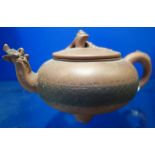 A CHINESE YIXING TEAPOT, QING DYNASTY, of compressed globular form, 10cm high