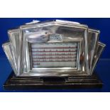 AN ART DECO SILVER FRONTED CALENDAR