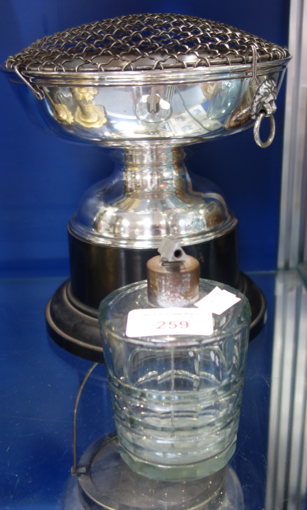A SILVER PLATED ROSE BOWL and an Art Deco cut glass scent bottle (2)