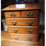 AN EDWARDIAN WALNUT MINIATURE CHEST OF DRAWERS, 43cm high