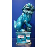 A GREEN GLAZED CHINESE TEMPLE LION, 24.5cm high