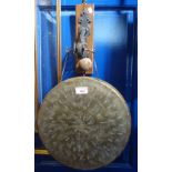 A 19TH CENTURY BRASS GONG on a wrought iron bracket