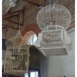 A VINTAGE INDIAN DESIGN WIREWORK AND WOODEN BIRD CAGE and another similar (2)