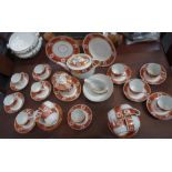 AN EARLY 19TH CENTURY DERBY STYLE PART TEASET decorated with orange and gilt floral bands (examine)