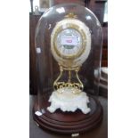 AN OSTRICH EGG MANTEL CLOCK under a glass dome