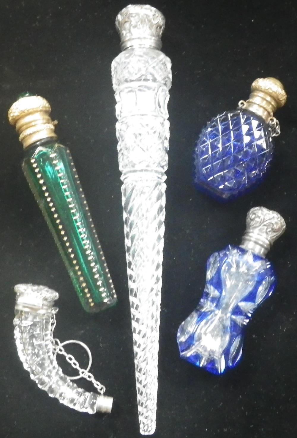 A VICTORIAN GREEN GLASS SCENT BOTTLE WITH GILT MOUNT, AND FOUR OTHERS SIMILAR (5)