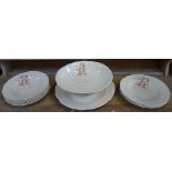 A FRENCH PART CREAM POTTERY DINNER SERVICE with transfer printed monogram 'R B', comprising footed